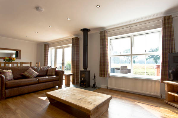 Huddle up to the wood-burning stove at Oakside Cottage Huddle up to the wood-burning stove at Oakside Cottage